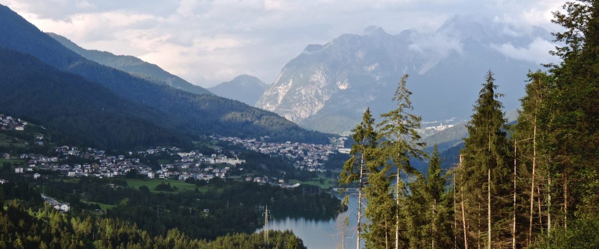 trees-mountains-against-river